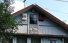 Почеп. Герб города на фасаде частного жилого дома